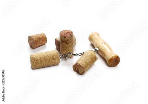 Corkscrew and wine cork isolated on white background