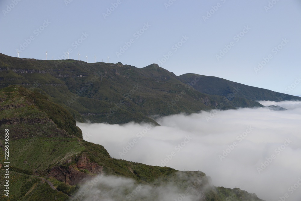 sea of clouds, mountains and windmills