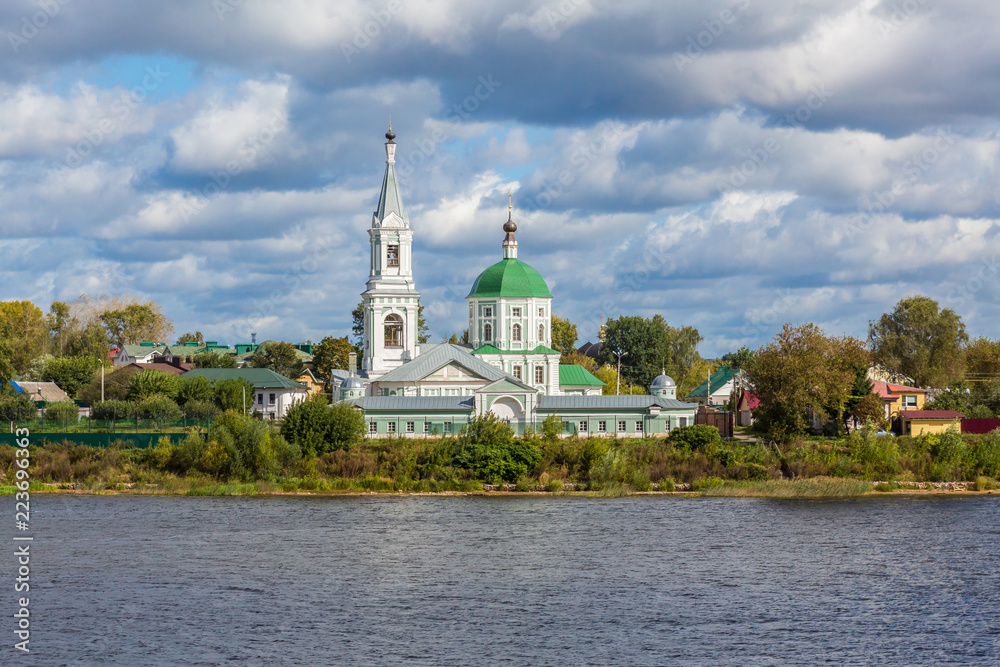 St. Catherine's convent. Russia, the city Tver. View of the monastery from the Volga river. Picturesque clouds in the sky. Summer or autumn day.