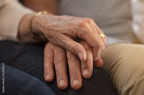 Senior couple holding hands