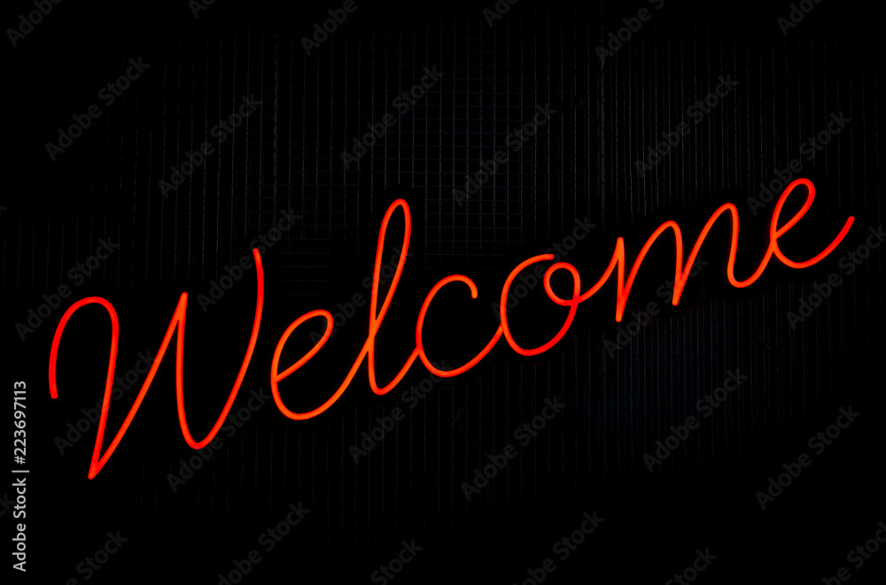 Red neon 'Welcome' sign Red neon 'Welcome' sign