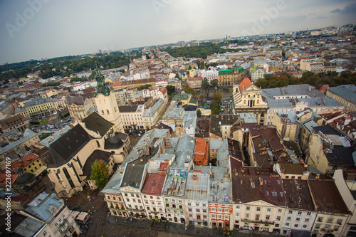 Aerial view old european city with rainy clouds on background © Svetlana