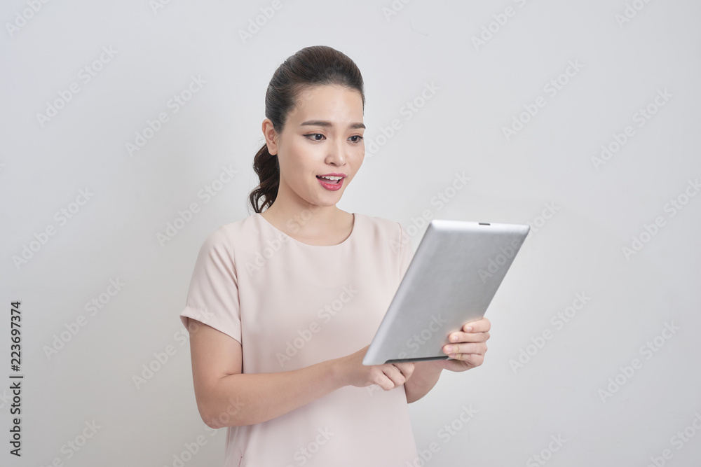 Portrait of smiling lovely business lady using digital tablet Portrait of smiling lovely business lady using digital tablet