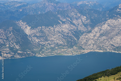 Lake Garda (Italy) and the mountains that surround it seen from the top of Monte Baldo. Italian landscape.