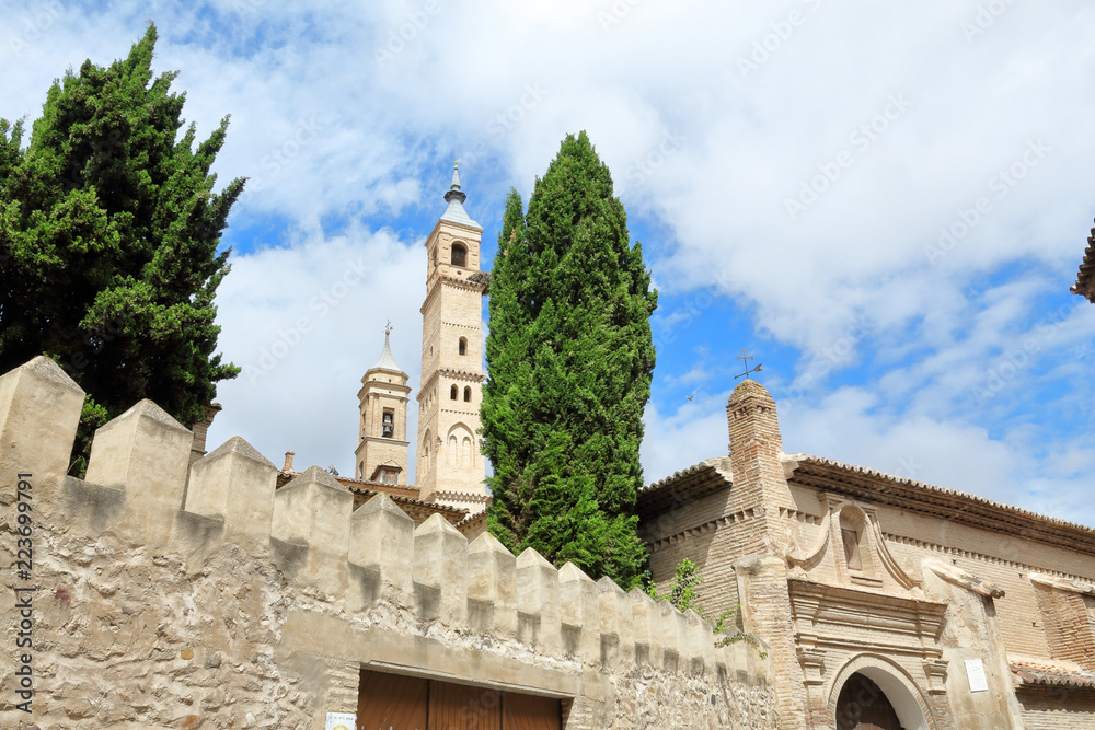 The bell tower of the Holy Mary Collegiate ( Colegiata de Santa Maria), seen from the Calle Goya street in Borja, a small Aragonese town in Spain