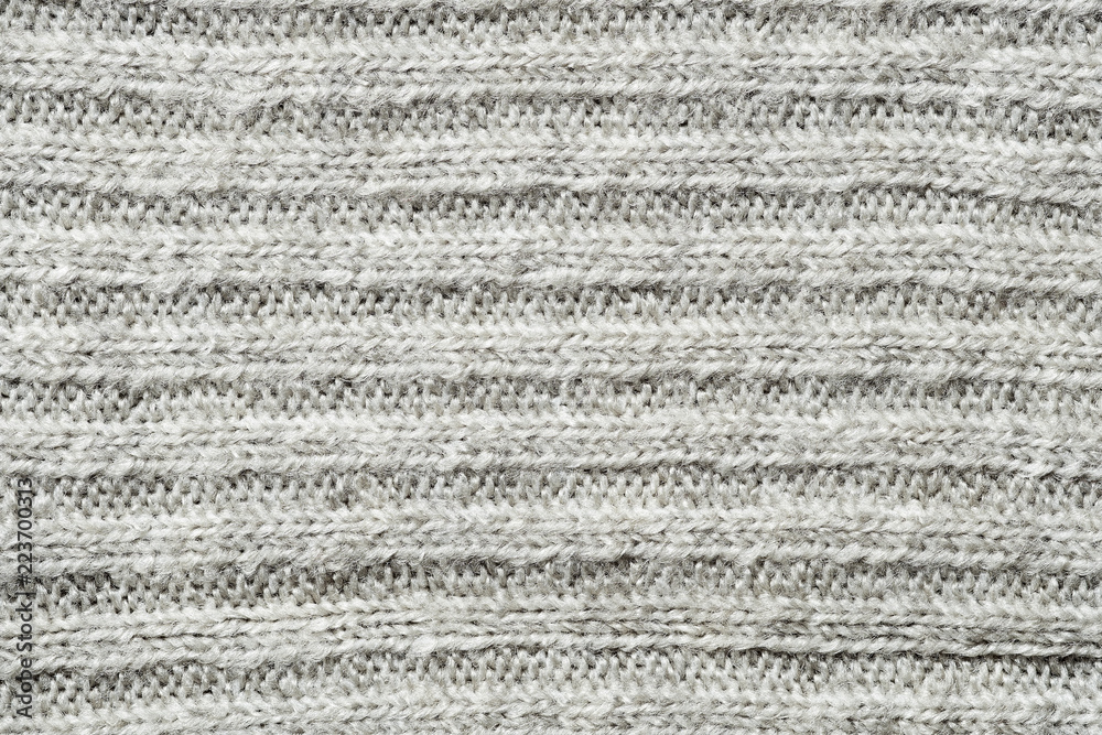 Texture of knitted fabric. Stranded threads. Cloth of warm winter clothes.