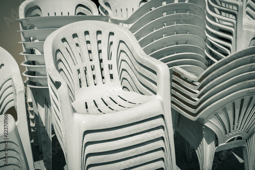 dirty old stacks of plastic chairs