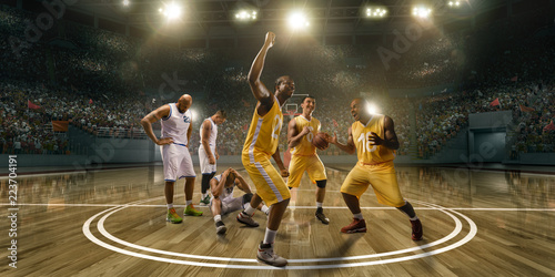 Photography Basketball players emotionally rejoice at victory on professional basketball stadium
