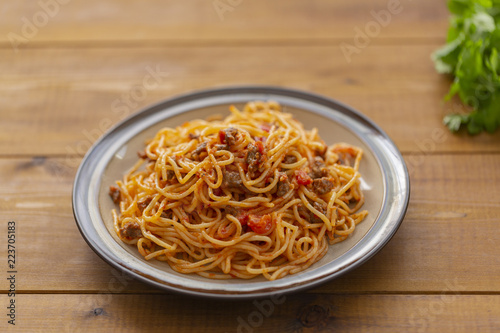 Spaghetti bolognese pasta with tomato sauce and minced meat. Homemade healthy italian pasta on wooden background
