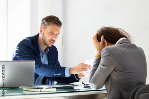Businessman Shouting At Female Employee