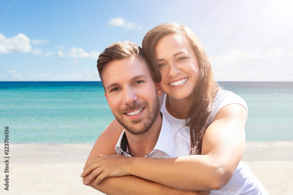 Happy Couple Having Fun At Beach