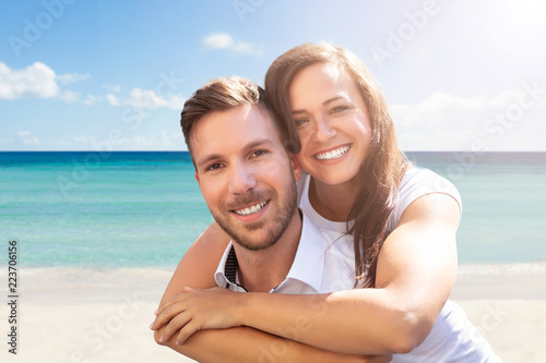 Happy Couple Having Fun At Beach