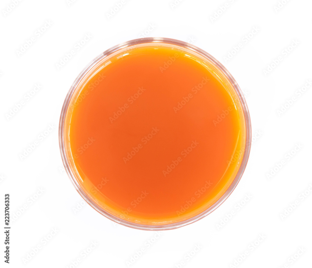 Closeup top view glass of fresh carrot juice isolated on white background, healthy diet food drink Closeup top view glass of fresh carrot juice isolated on white background, healthy diet food drink