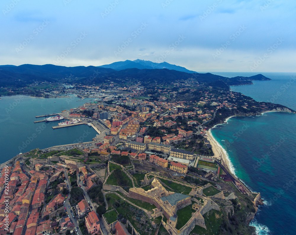 The landscape of Elba island, Italy. Aerial view of the Fort, pier and sandy beach near Portoferraio