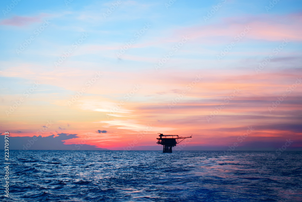 Fototapeta premium Offshore oil and gas industry, well head remote platform where produced raw gas and crude oil for sent to central processing platform, surface tools of well service worker on deck.