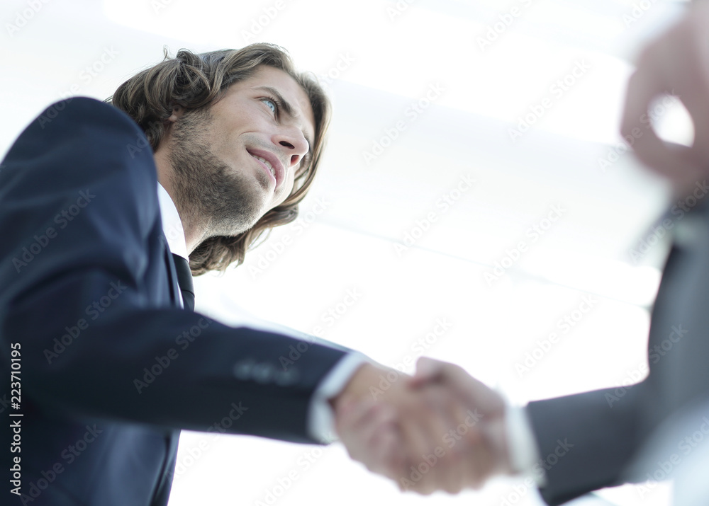 Successful business people handshaking after good deal. Successful business people handshaking after good deal.