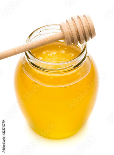 Natural honey in a glass jar