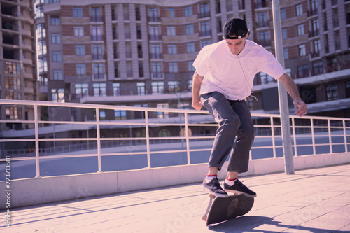 Feel adrenaline. Serious boy being outside and training before performance © zinkevych