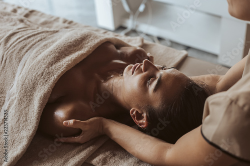 Woman enjoying massage in Spa