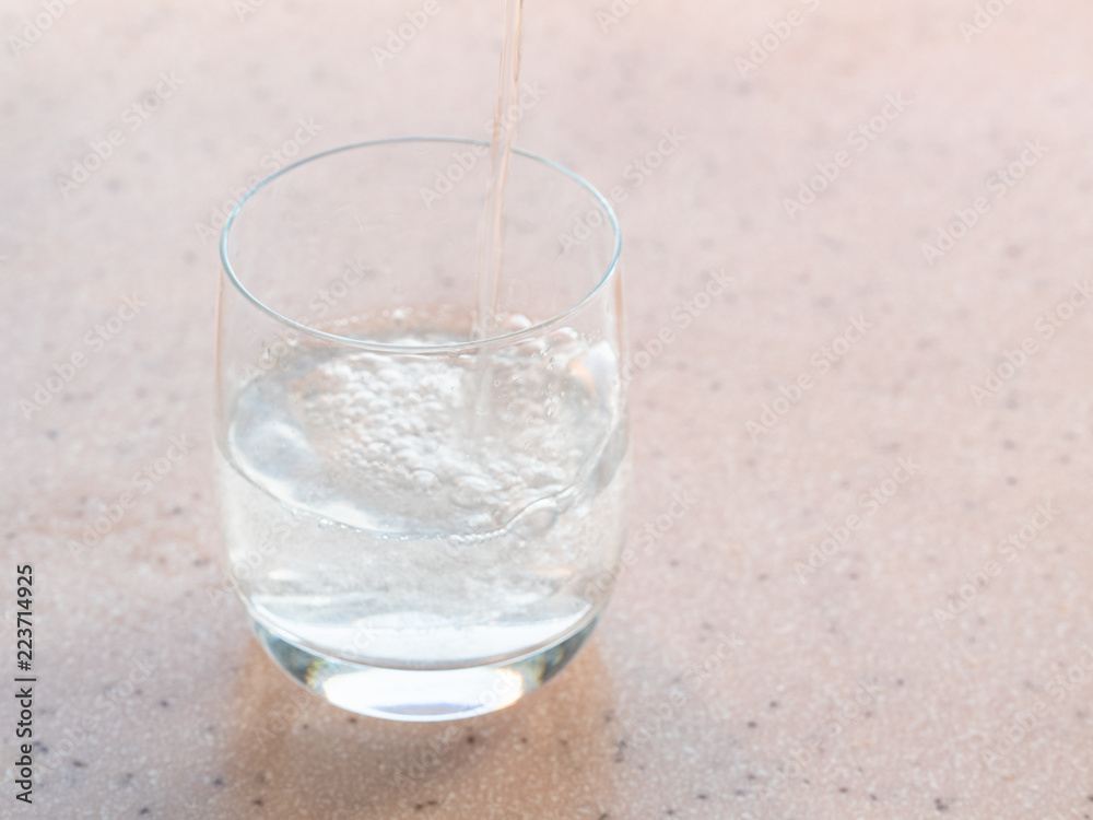 sparkling mineral water fills a glass sparkling mineral water fills a glass