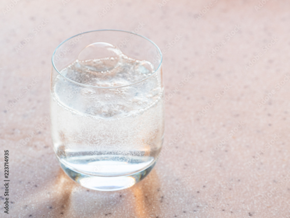 gas bubbles in glass with sparkling mineral water