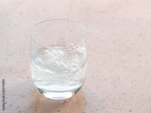 sparkling mineral water fills a glass