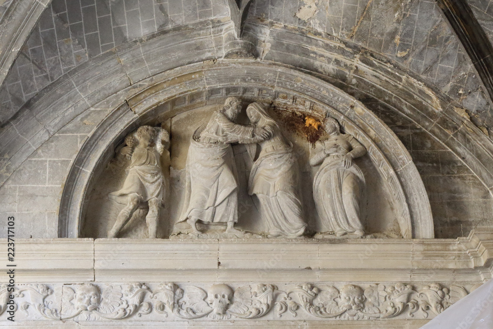 A sculpture over an arch in the internal cloister in the Holy Mary Church (Iglesia de Santa Maria) in Uncastillo, a small rural town in the Pre-Pyrenees in the Aragon region, in Spain