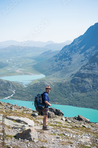 hiker standing on Besseggen ridge in Jotunheimen National Park, Norway