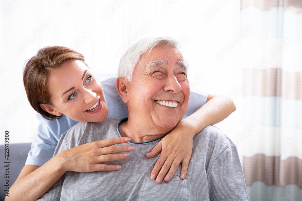 Nurse Pointing At Something To Senior Man Nurse Pointing At Something To Senior Man