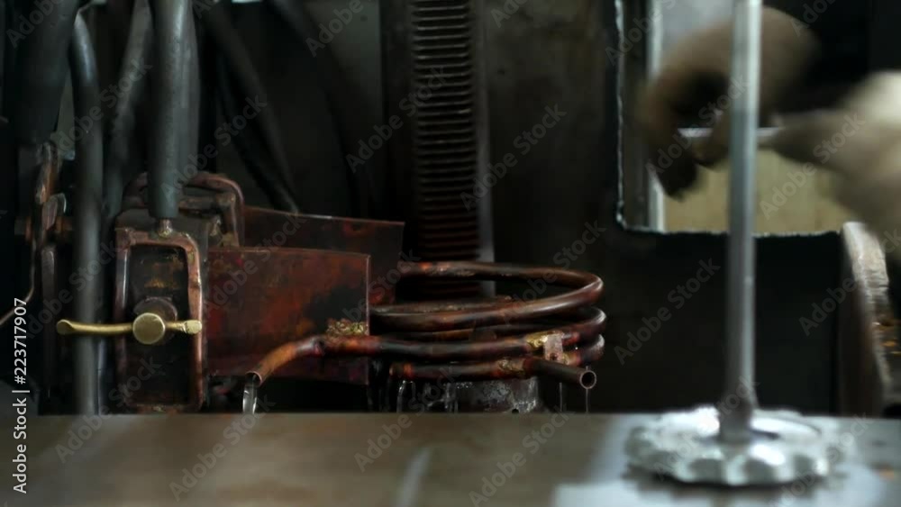 Hardening and heat treatment of metal parts in mechanical engineering, hardening of metal, close-up, industry Hardening and heat treatment of metal parts in mechanical engineering, hardening of metal, close-up, industry