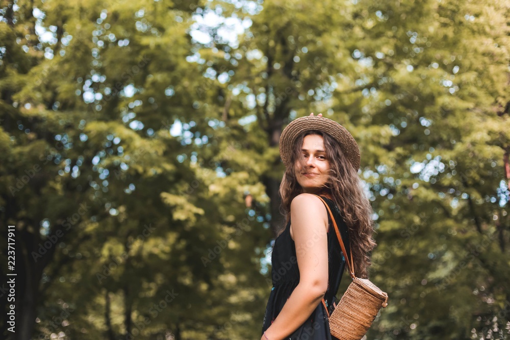 girl traveler in a straw hat in the forest. girl traveler in a straw hat in the forest.