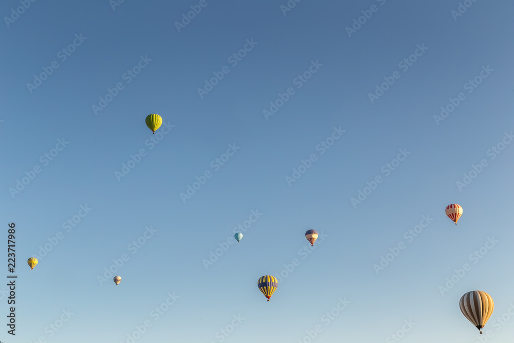 Fototapeta premium The great tourist attraction of Cappadocia - balloon flight. Cappadocia is known around the world as one of the best places to fly with hot air balloons. Goreme, Cappadocia, Turkey