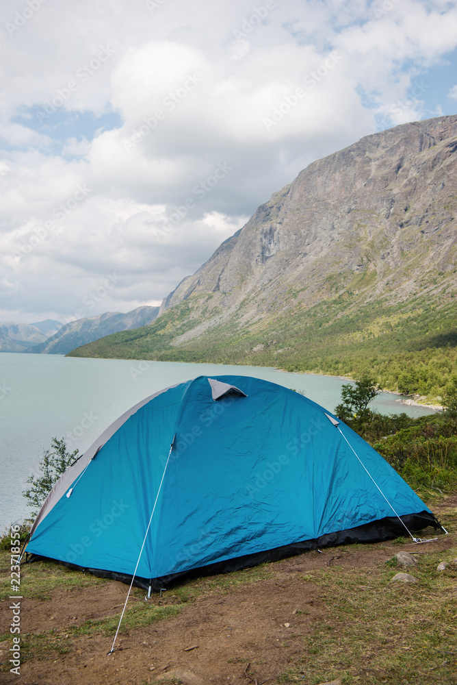 camp tent on Besseggen ridge over Gjende lake in Jotunheimen National Park, Norway