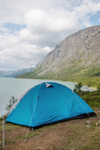 camp tent on Besseggen ridge over Gjende lake in Jotunheimen National Park, Norway