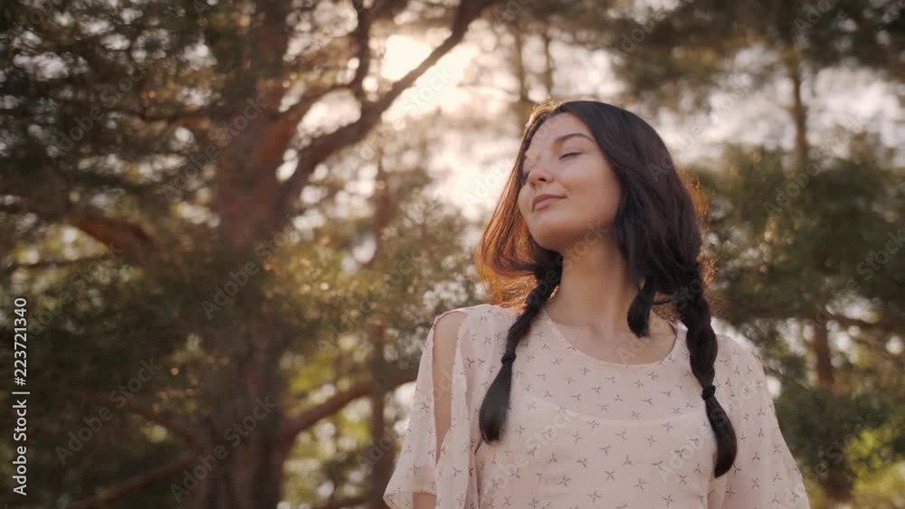 Free happy woman in forest enjoying nature. Natural beauty girl outdoor in freedom enjoyment concept. Mixed race Caucasian Asian girl posing on travel vacation holidays in dress. Slow motion 4k Free happy woman in forest enjoying nature. Natural beauty girl outdoor in freedom enjoyment concept. Mixed race Caucasian Asian girl posing on travel vacation holidays in dress. Slow motion 4k