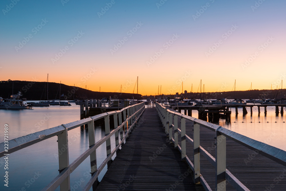 Perspective view of Balmoral Beach pier at dawn. Sydney, Australia.