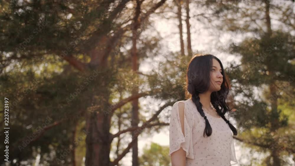 Free happy woman in forest enjoying nature. Natural beauty girl outdoor in freedom enjoyment concept. Mixed race Caucasian Asian girl posing on travel vacation holidays in dress. Slow motion 4k Free happy woman in forest enjoying nature. Natural beauty girl outdoor in freedom enjoyment concept. Mixed race Caucasian Asian girl posing on travel vacation holidays in dress. Slow motion 4k