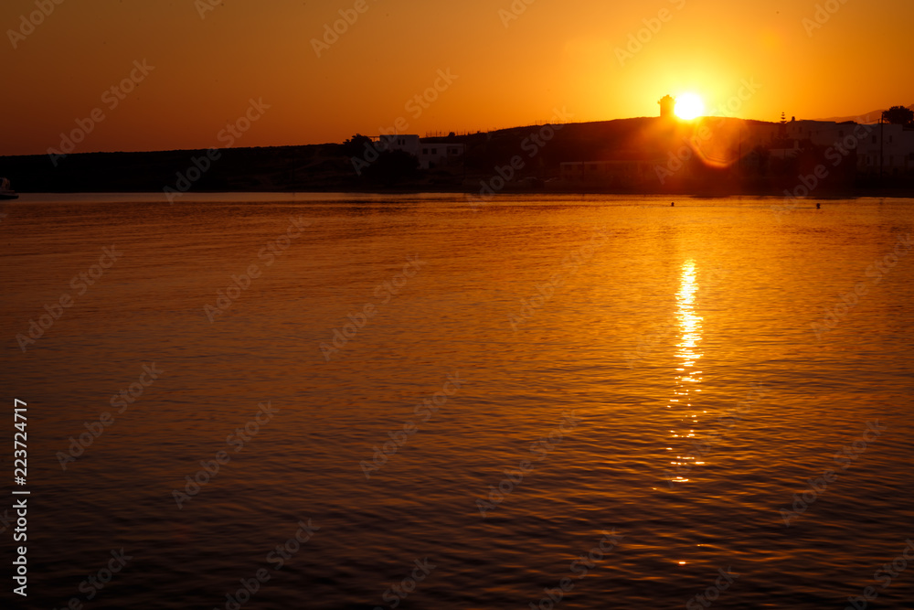 sunrise over lighthouse and sea in mediteranean greek cycladic island paros 4
