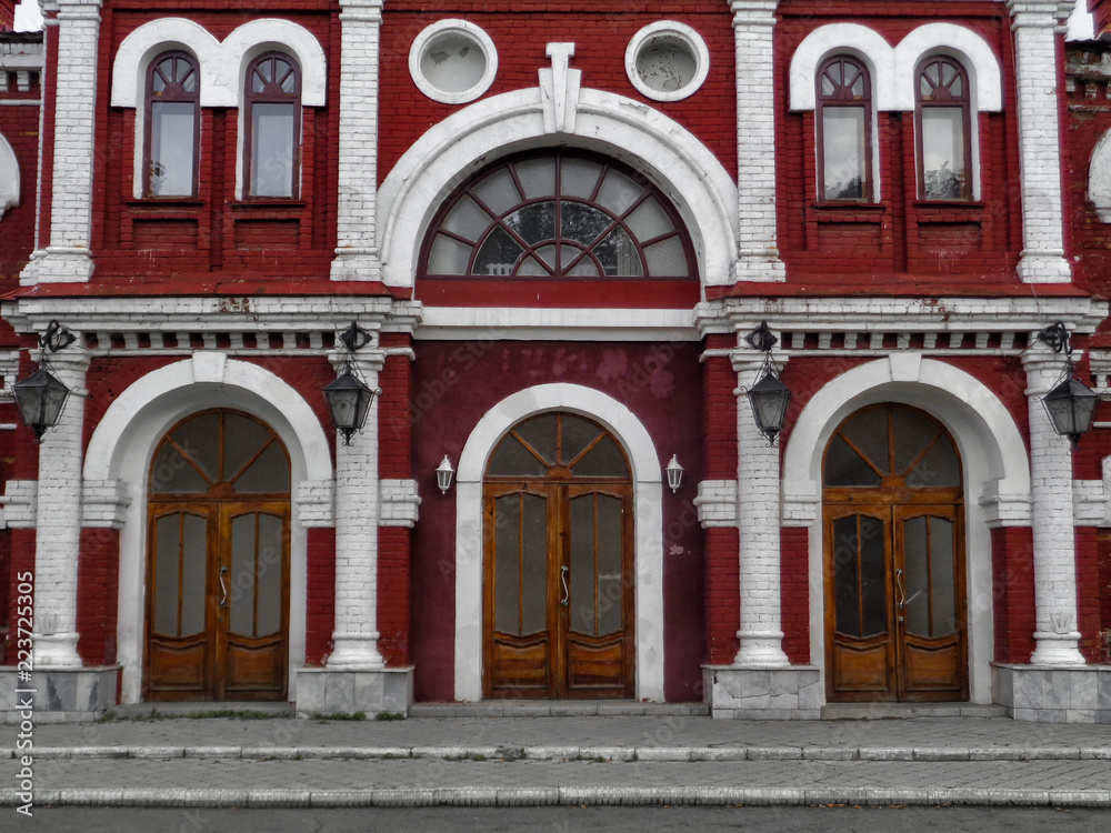 East Kazakhstan Drama Theater. Kazakhstan (Ust-Kamenogorsk). Fragment. Red brick. Old architecture. Architectural heritage. Neoclassicism