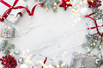 Christmas and New Year holiday background. Xmas greeting card. Christmas gifts on white marble background top view. Flat lay