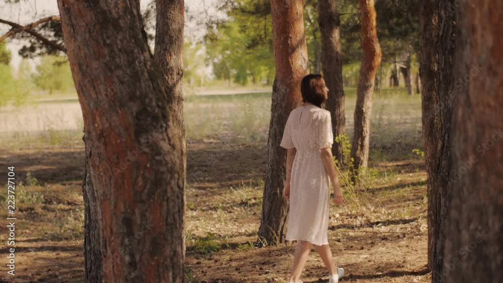 Free happy woman in forest enjoying nature. Natural beauty girl outdoor in freedom enjoyment concept. Mixed race Caucasian Asian girl posing on travel vacation holidays in dress. Slow motion 4k Free happy woman in forest enjoying nature. Natural beauty girl outdoor in freedom enjoyment concept. Mixed race Caucasian Asian girl posing on travel vacation holidays in dress. Slow motion 4k