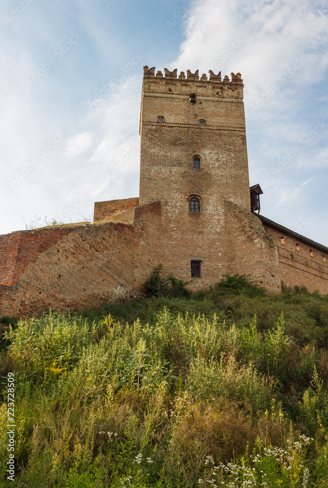The medieval castle is illuminated by the sunset. Lutsk High Castle, also known as Lubart's Castle The medieval castle is illuminated by the sunset. Lutsk High Castle, also known as Lubart's Castle