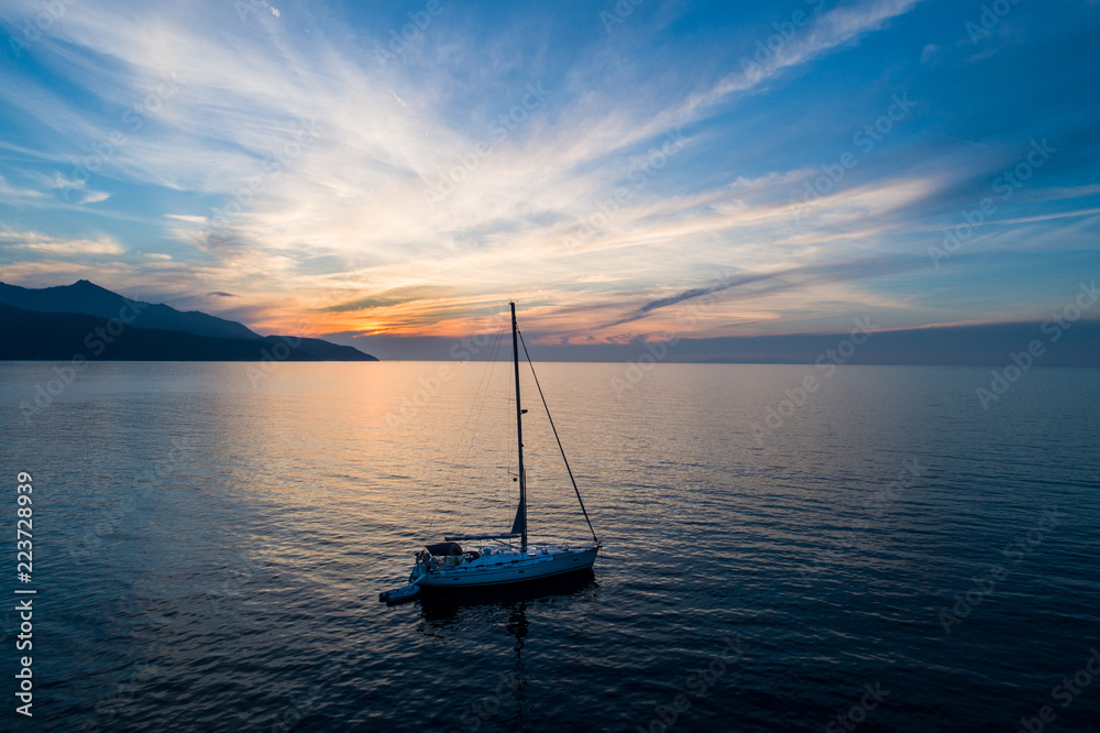 Sailboat in the mediterranean sea, 
beautiful sunset. Aerial shot