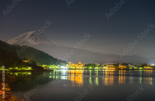landscape view of Fuji Mountain and Kawaguchiko lake at night from Yamanashi Prefecture, Japan.