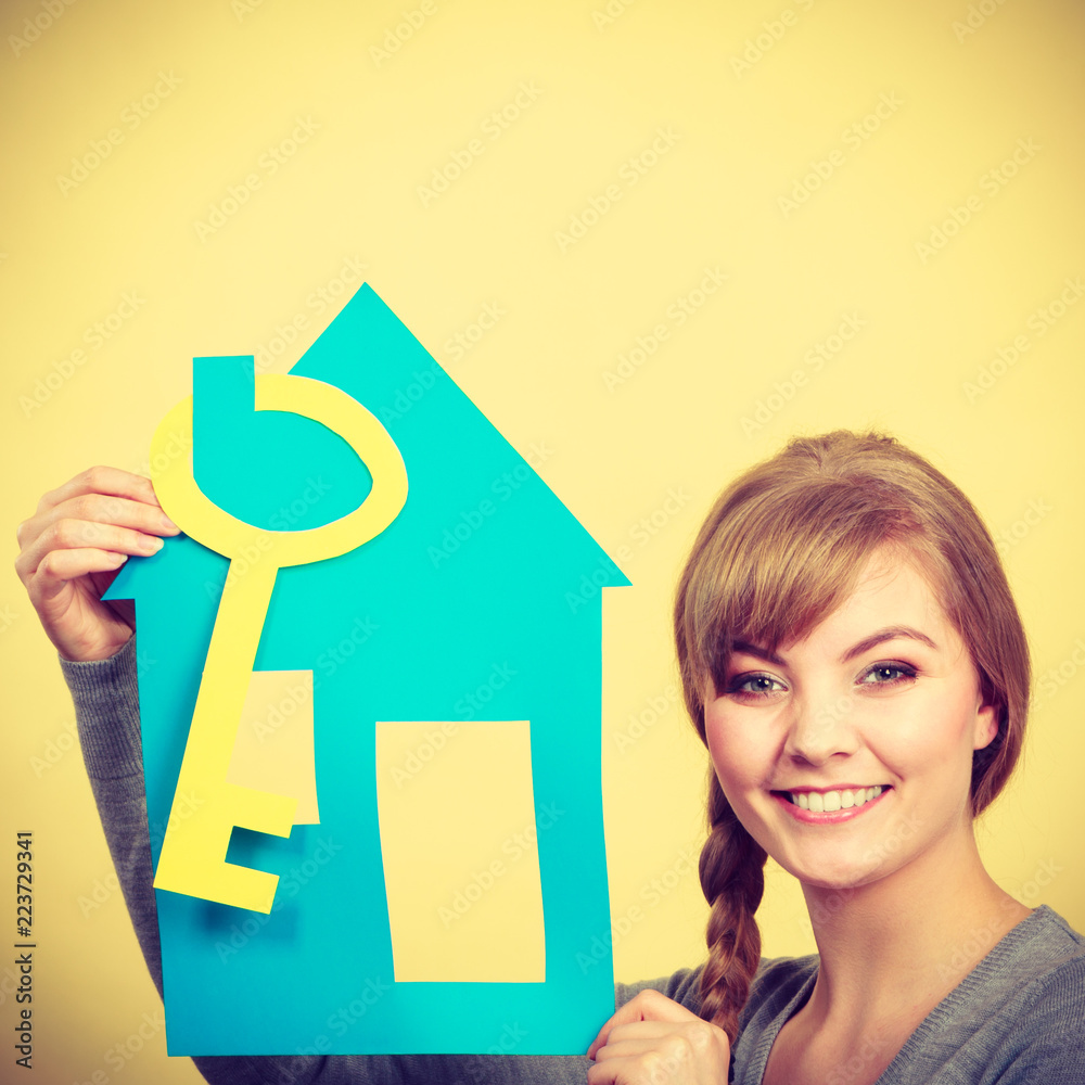 Blonde woman with house and key. Blonde woman with house and key.