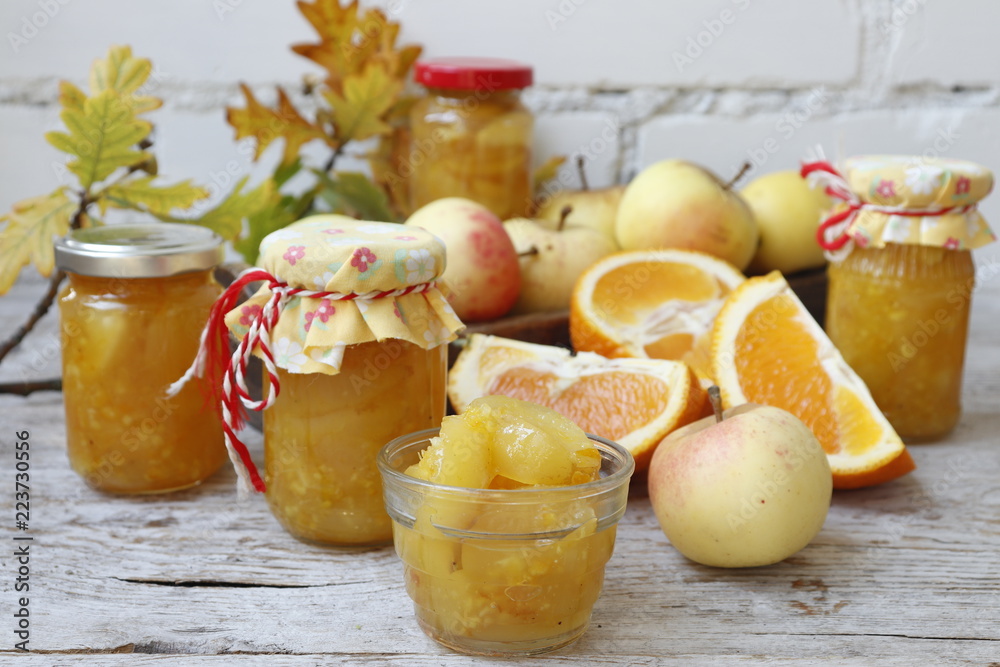 Apple confiture with orange in Mason glass jars