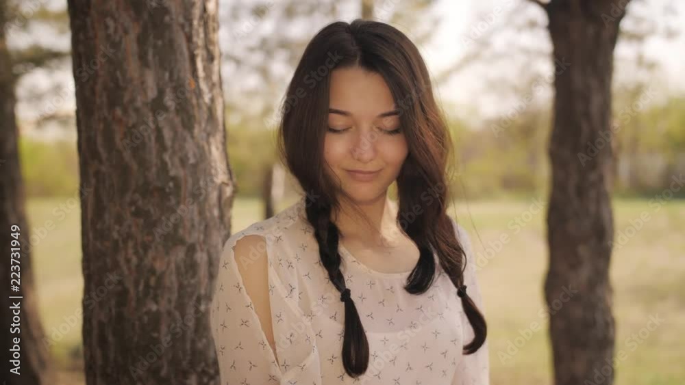 Free happy woman in forest enjoying nature. Natural beauty girl outdoor in freedom enjoyment concept. Mixed race Caucasian Asian girl posing on travel vacation holidays in dress. Slow motion 4k Free happy woman in forest enjoying nature. Natural beauty girl outdoor in freedom enjoyment concept. Mixed race Caucasian Asian girl posing on travel vacation holidays in dress. Slow motion 4k