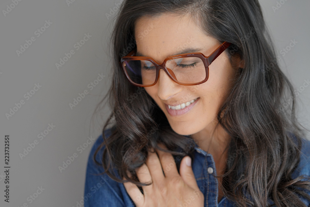 Portrait of attractive brunette woman with eyeglasses, isolated