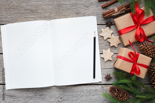 Writing letter to santa on wooden background,