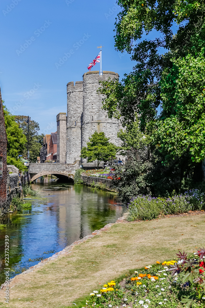 View on the Westgate towers from the wWetsgate gardens park in Canterbury on a sunny day, England, UK View on the Westgate towers from the wWetsgate gardens park in Canterbury on a sunny day, England, UK